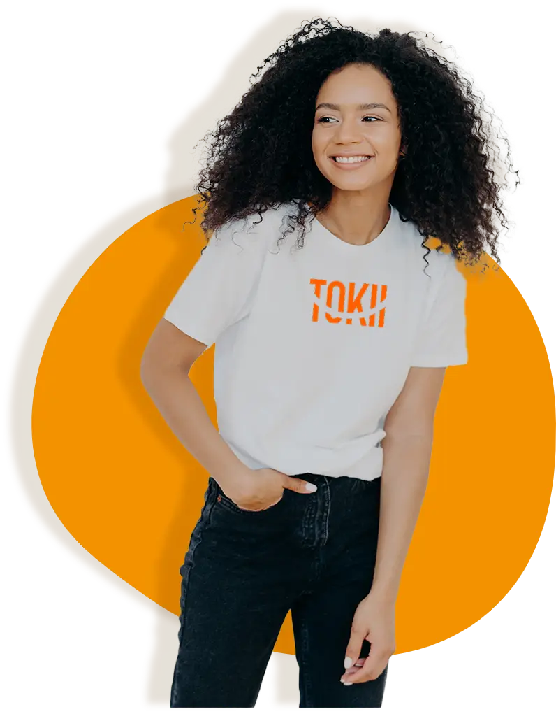 A woman wearing a t-shirt featuring the Tokii logo